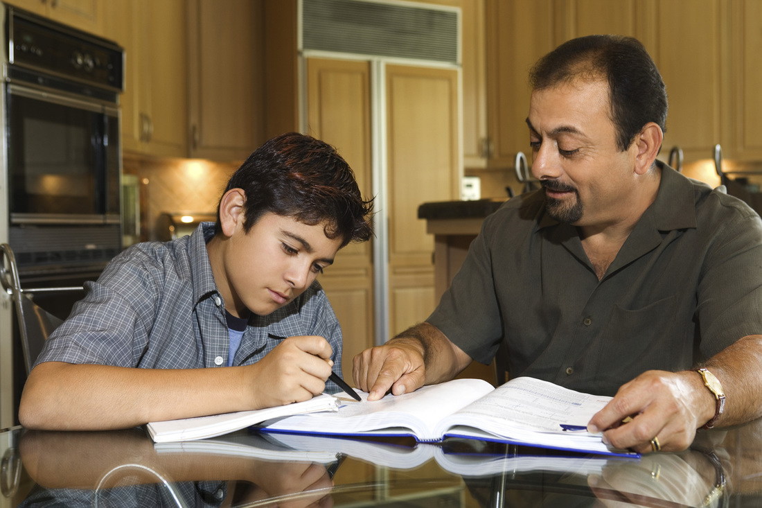 dad/father helping child with homework